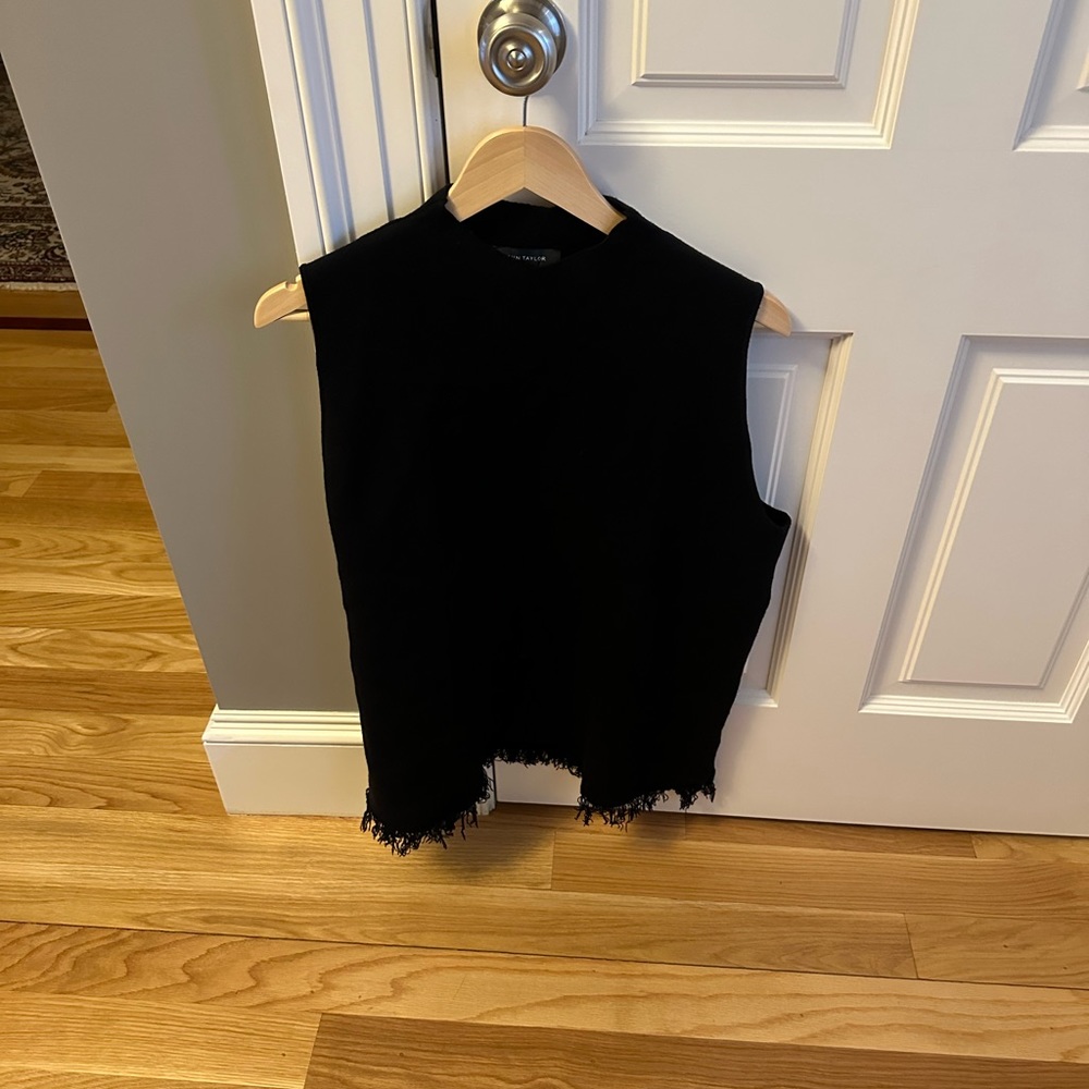 Brand new black shell. Super cool fringe trim along the bottom.